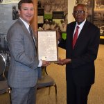 President Bob Methvin presents Fred David Gray with a framed copy of the resolutions.